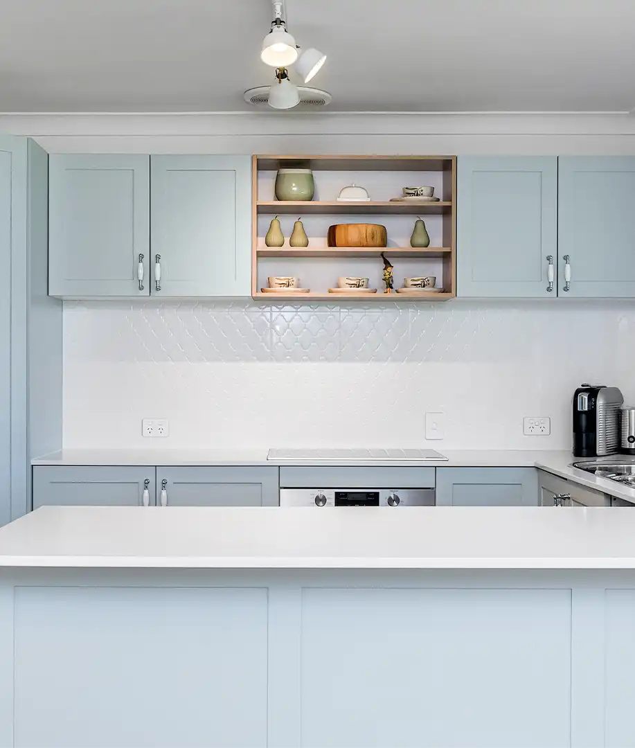 a light blue coastal cottage kitchen designed and installed by glenlyon kitchens