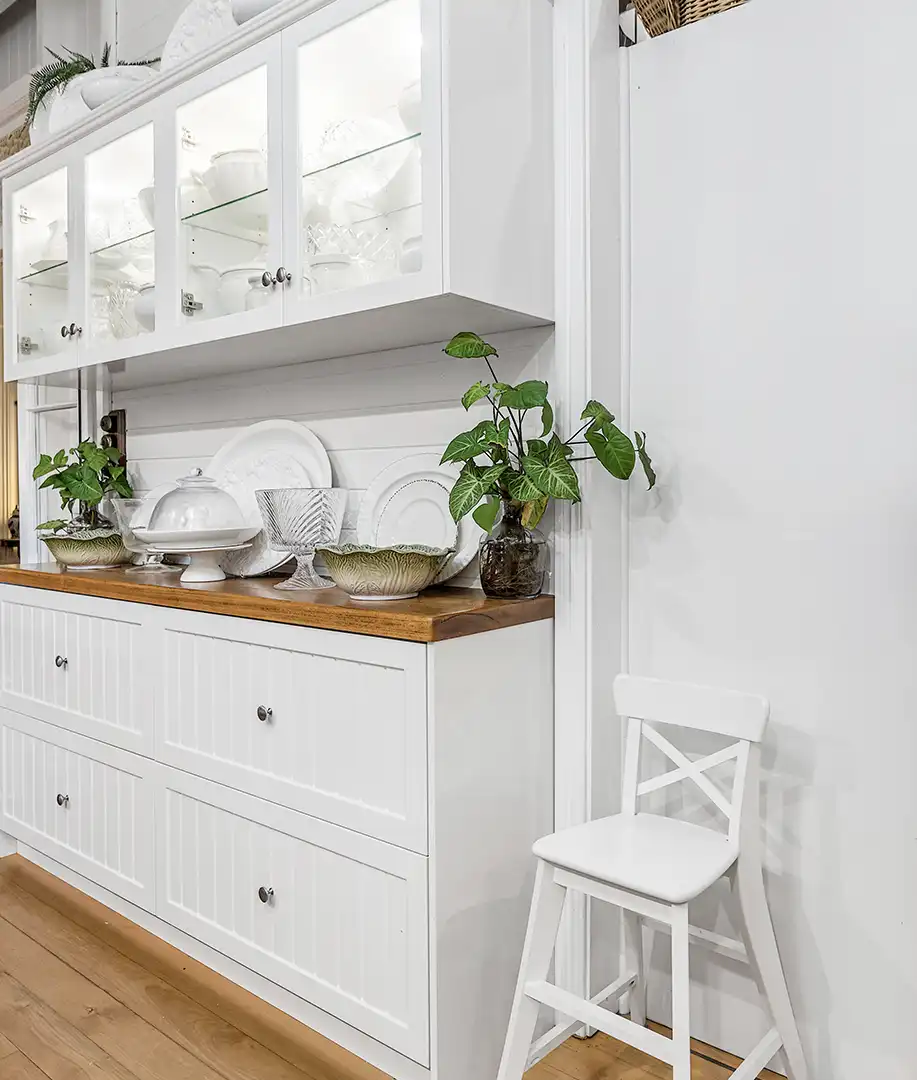 a charming white styled kitchen designed and installed by glenlyon kitchens showing the side cabinets